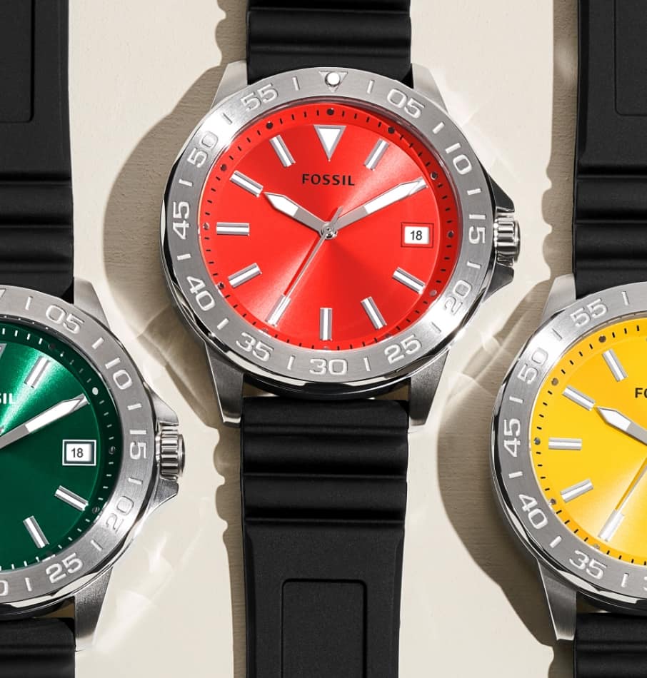 Men’s sporty watches with a black strap and colourful dials in orange, green, red, yellow and blue.