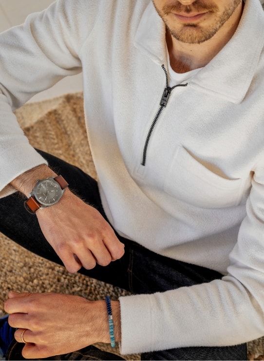 A man wearing the brown leather Machine watch.