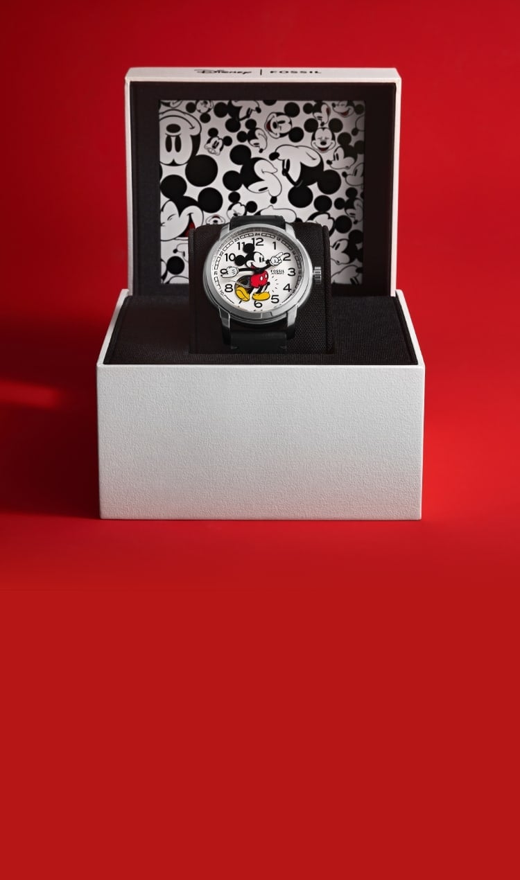The collectible packaging featuring a white box with custom Mickey graphics. The box is open to display the Classic Disney Mickey Mouse Watch.