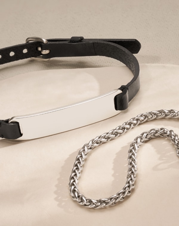An ID bracelet and a stainless steel chain bracelet