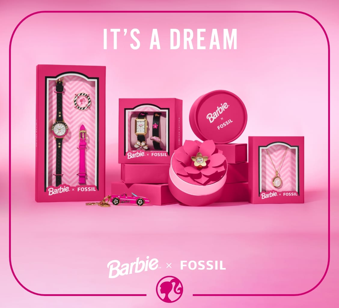 A pink background with multiple pieces from the Barbie x Fossil collection: our limited edition Barbie™ x Fossil Three-Hand Black LiteHide™ Leather Watch, Raquel Watch, Barbie Keyfob, Watch Ring and Gold-Tone Locket Necklace.