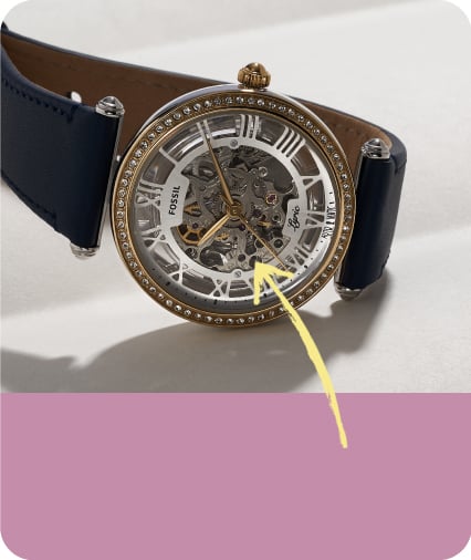 a mechanical watch with an arrow pointing to a highlighted item