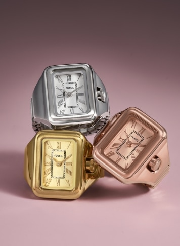 A stack of three Watch Rings in silver tone, gold tone and rose gold tone.