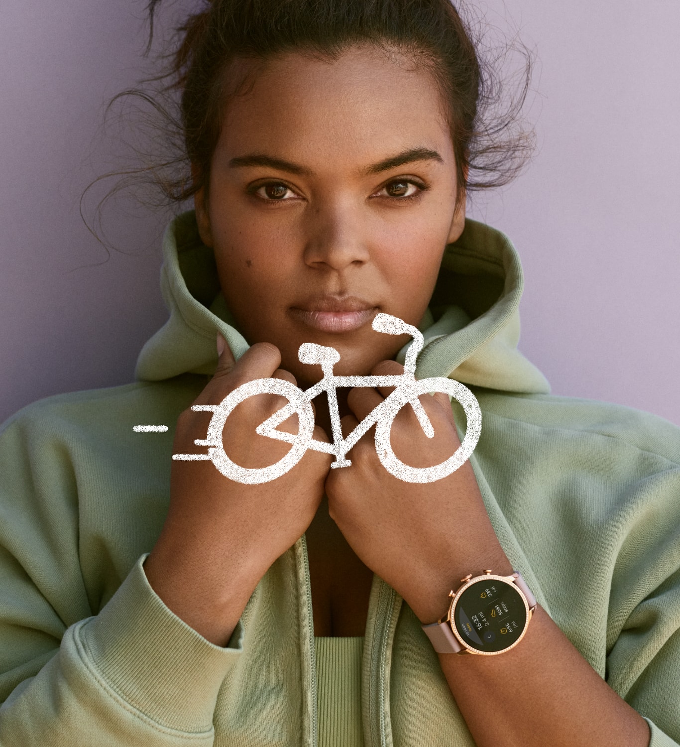 Una donna con una felpa verde con cappuccio che indossa uno smartwatch Gen 6. Una donna con una felpa verde con cappuccio che indossa uno smartwatch Gen 6.