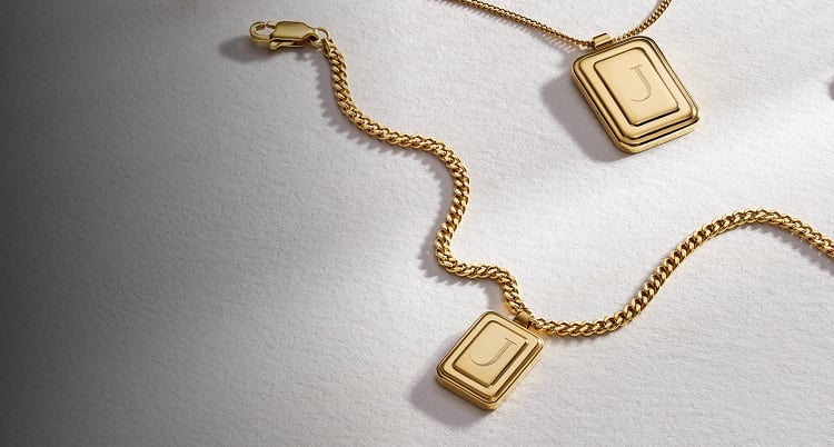 The Fossil Raquel engravable pendant necklace in a gold-tone finish.