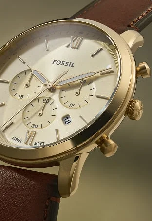 The classic midcentury-inspired Neutra watch shown with a cream dial and brown leather strap.