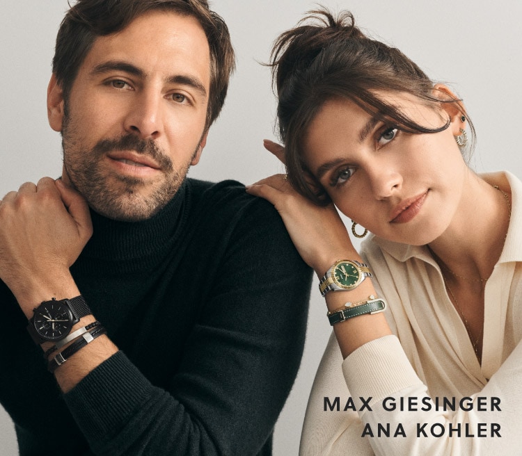 Ana and Max are sitting. They're wearing different Fossil pieces.