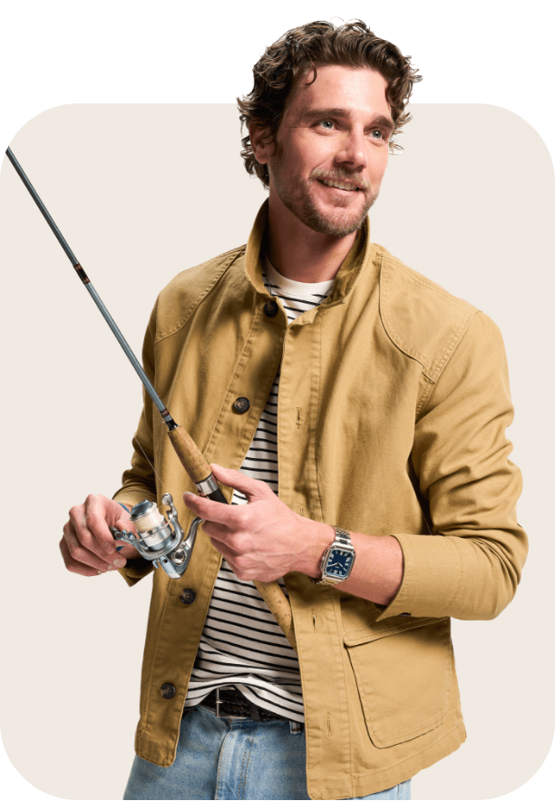 Dad wearing watch while holding a fishing rod.