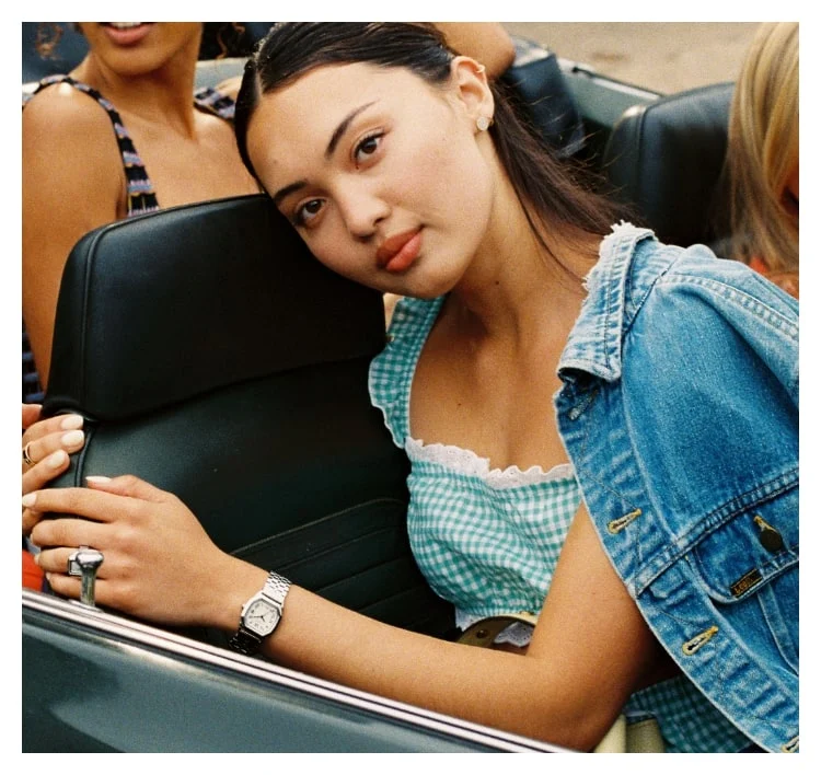 A group of friends in a vintage car.