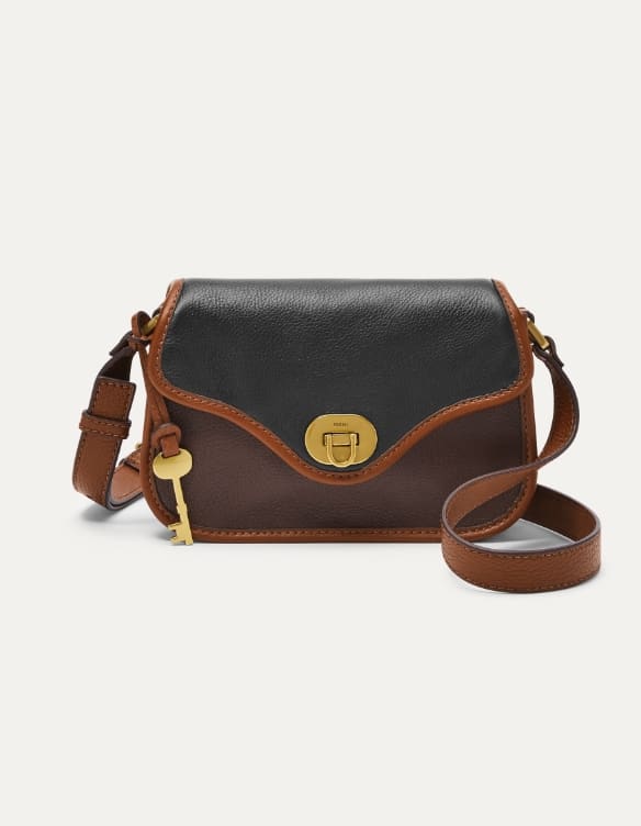 Tasche Fossil Heritage aus schwarzem und braunem Leder.