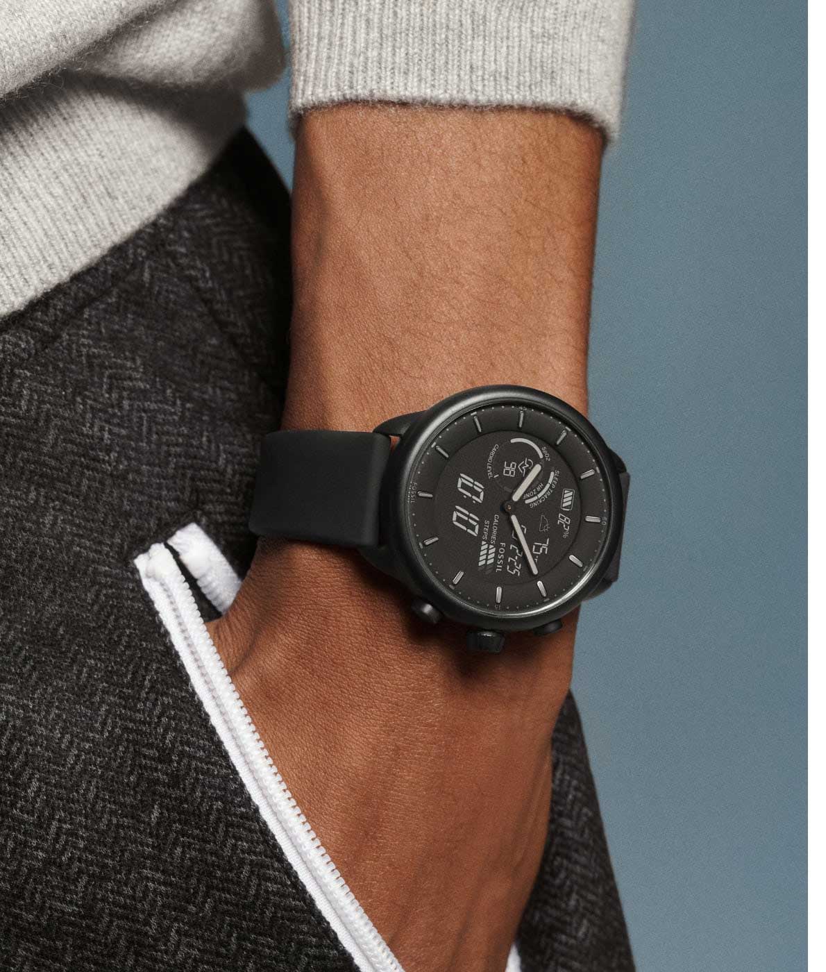 A man with his hand in his pocket wearing a black Gen 6 Hybrid Wellness Edition.