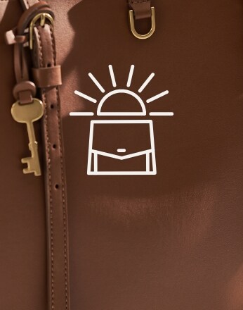 Bag icon over brown tote bag background.