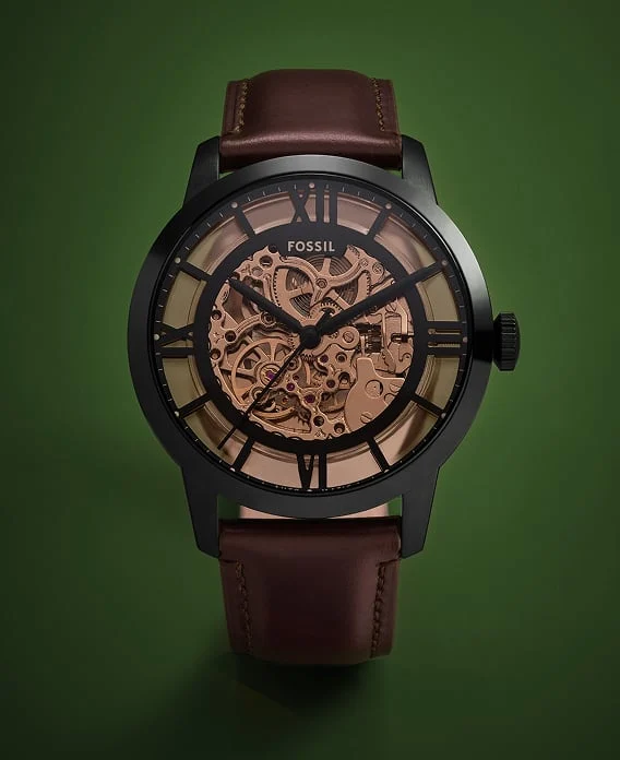 The Fossil Townsman automatic watch featuring a rose-gold tone skeletonised dial and deep brown finish.