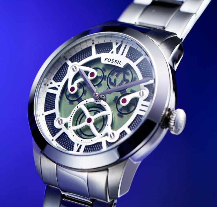 A detailed view of the digital spinning gears beneath a skeletonized dial.