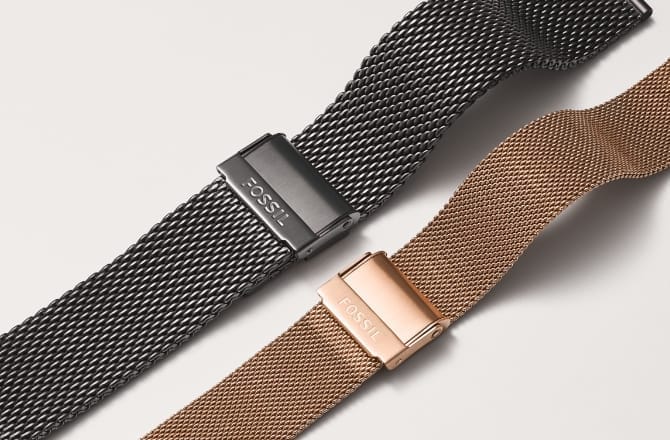 A grey stainless steel mesh watch strap and a rose gold-tone stainless steel mesh watch strap