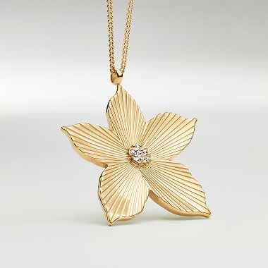 Gold-tone necklace charm.