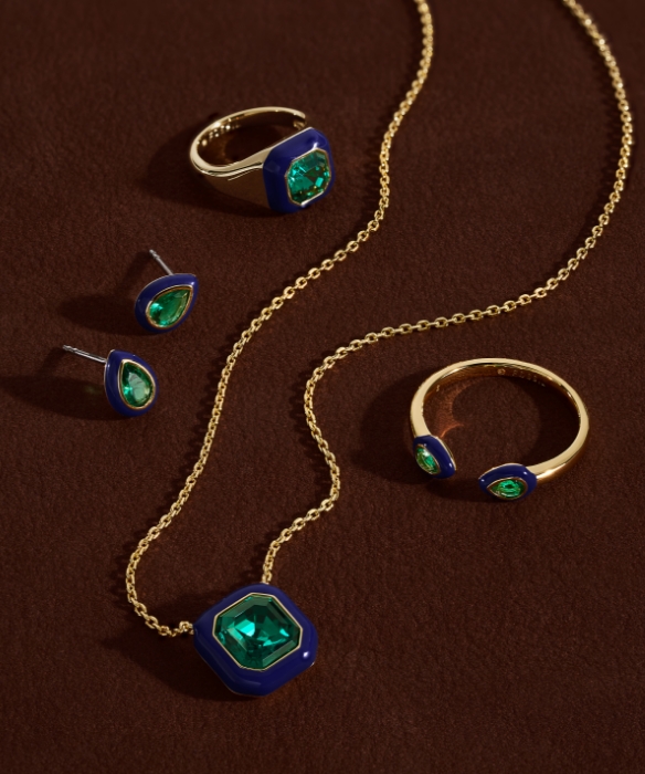 Various gold tone jewelry.