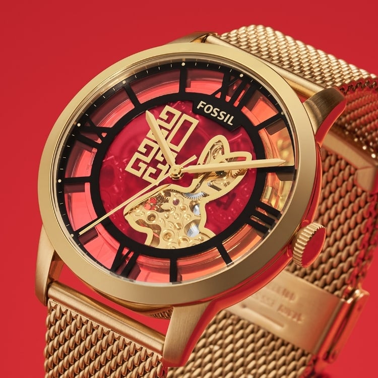 A rabbit graphic in the upper left corner. A gold-tone Townsman Automatic with 2023 and a rabbit on the dial.