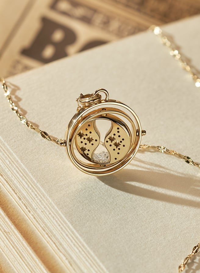 Gold-tone Time-Turner™ necklace.