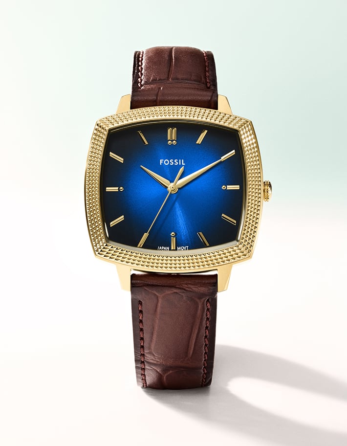 A cuffed stack of three Machine luxe watches...