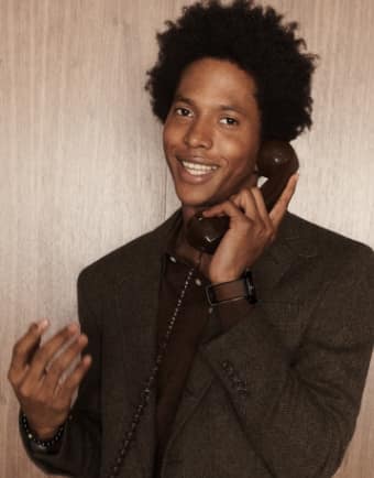 A man on the phone smiling. 