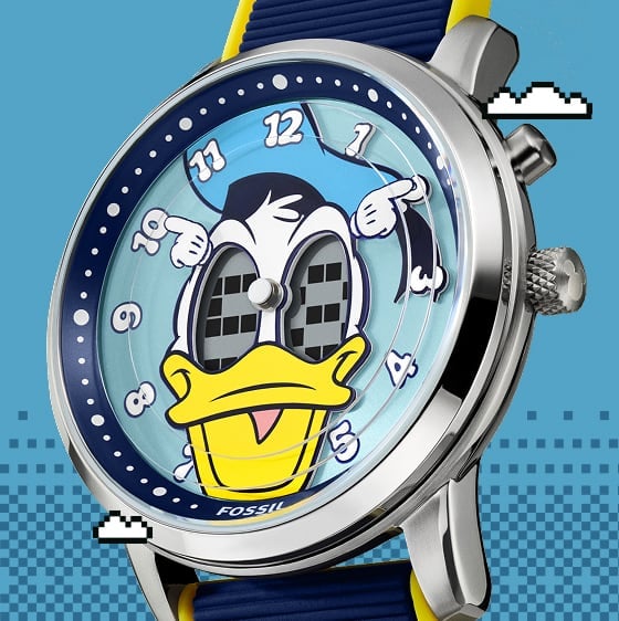 A close-up view of the Donald Duck watch dial. His expressive eyes are a digital display, along with his white-gloved hands as the hour and minute markers.