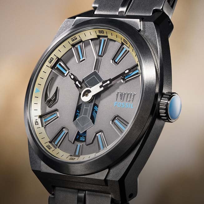 The Star Wars and Fossil Mandalorian collection, featuring the Fossil Limited-Edition Mandalorian and Grogu watches, along with their display packaging. 
