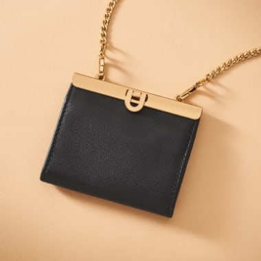 A black leather wallet on a chain.
