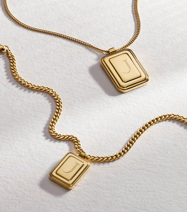 The Fossil Raquel engravable pendant necklace in a gold-tone finish.