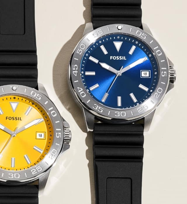 Men’s sporty watches with a black strap and colourful dials in orange, green, red, yellow and blue.