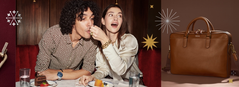 A woman feeding a man cake while wearing gold-tone jewelry. Star graphics.