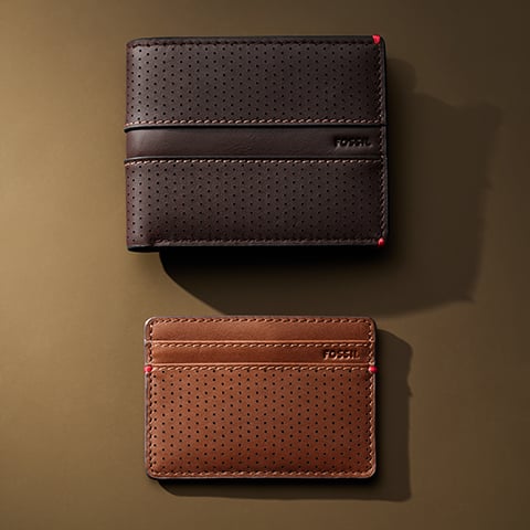 A black leather and a brown leather wallet