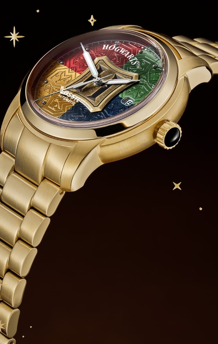 Reloj automático Harry Potter™ en tono dorado con los colores de las casas de Hogwarts™ en la esfera. 