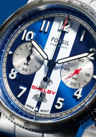 Two views of the Shelby Grand Tourer chronograph watch, highlighting the iconic blue and white striped dial, and stainless steel case and bracelet.