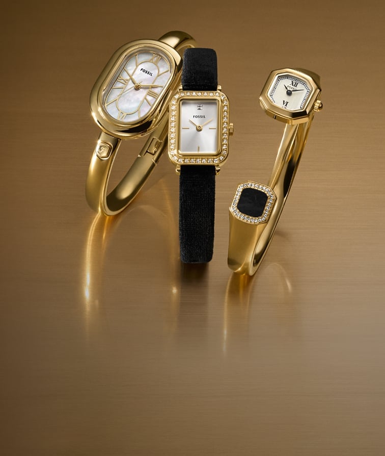 Three elegant women's watches dressed in black and gold-tone, including bangle cuff bracelets, velvet straps, crystal-embellished accents and statement shaped dials.