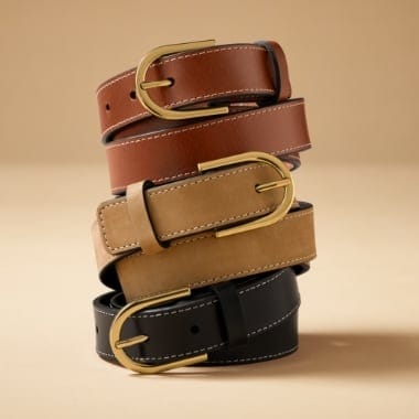 A stack of women's leather belts.