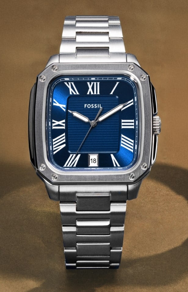 The Crosby watch shown in three finishes: silver-tone with a black dial, silver-tone with a vibrant blue dial and two-tone with a black dial.