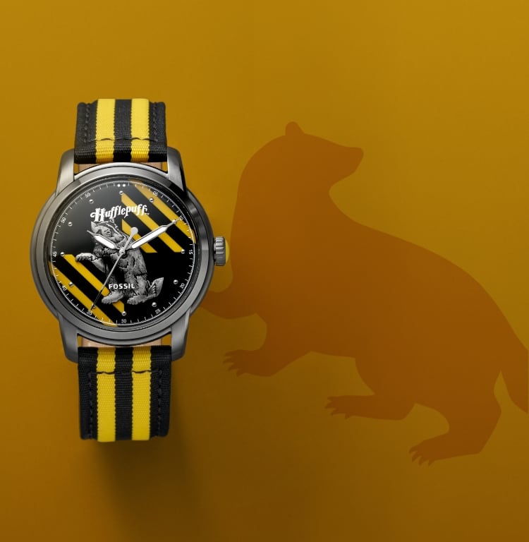 Silver-tone Hufflepuff house watch with a black and yellow strap.