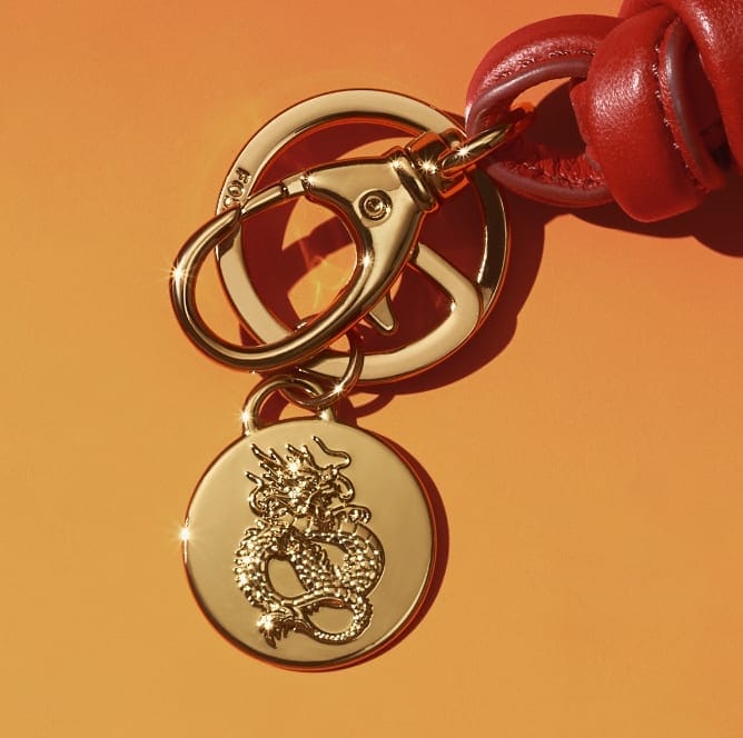 A gold-tone dragon key fob.