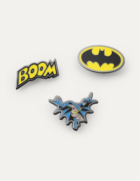 Assorted Batman enamel pins.