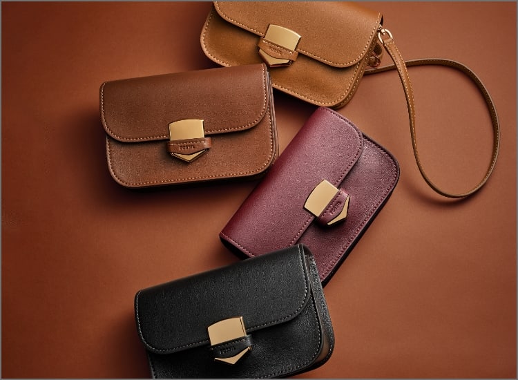 Four leather Lennox handbags in light brown, brown, maroon and black.