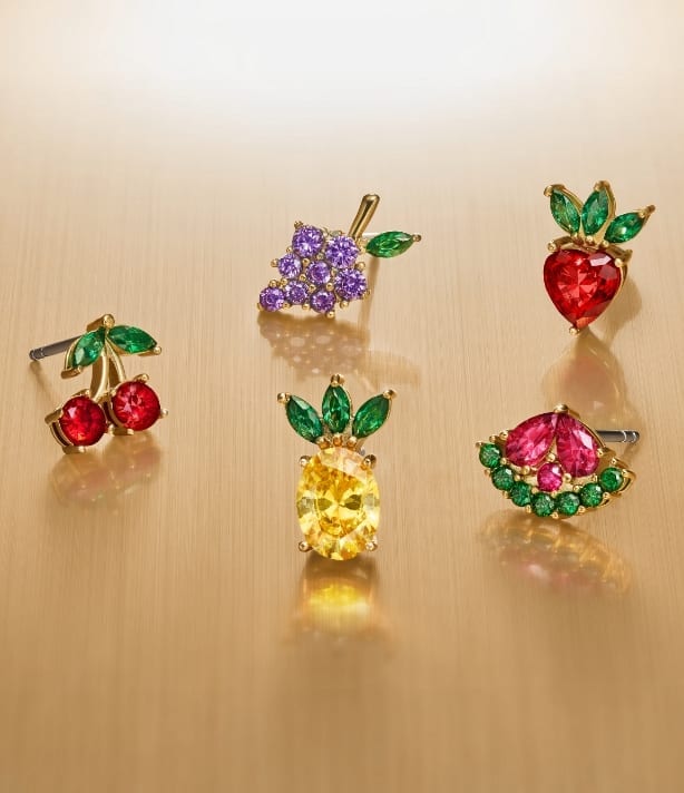 Five fruit-shaped crystal stud earrings. 