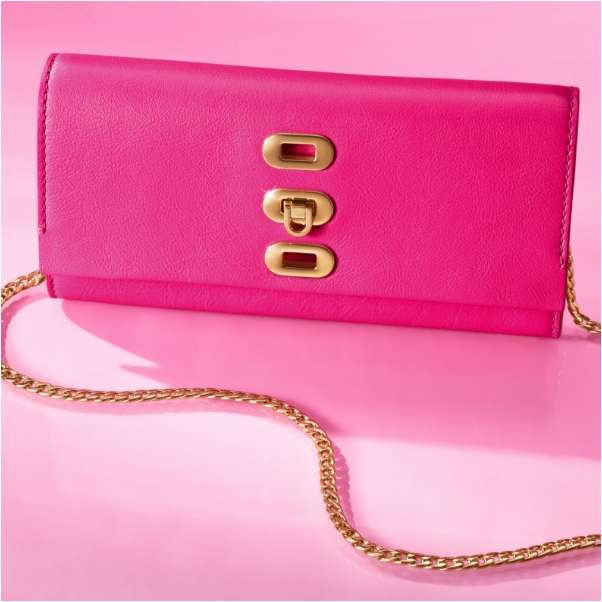 A pink background with our limited edition Barbie™ x Fossil Liza camera bag, featuring signature pink smooth-grain leather and an extra wide, 90s-inspired sporty strap with pink stripes.