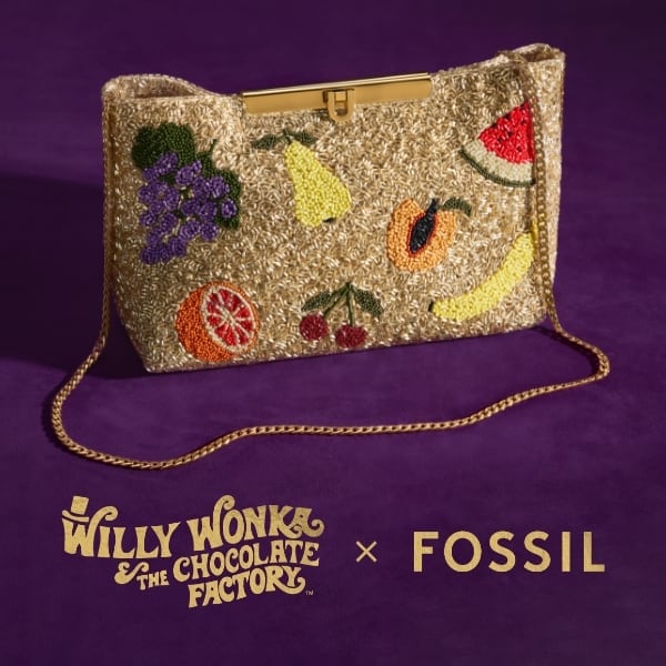 The special edition, hand-beaded clutch bag featuring fruit accents that were inspired by the film’s famous lickable wallpaper. Willy Wonka & The Chocolate Factory x Fossil logo