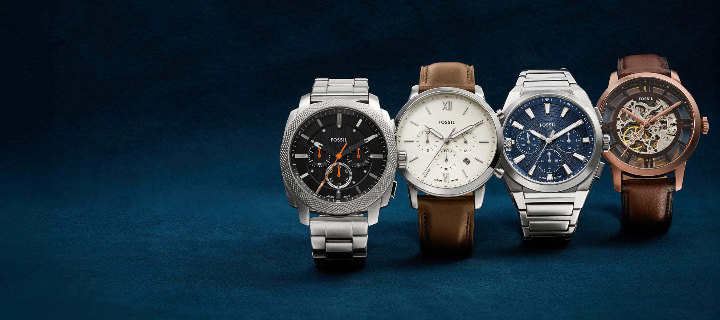 A row of men's watches featuring a variety of movement types, dials and bracelets.