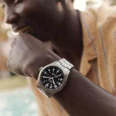 A man wearing a Neutra watch.
