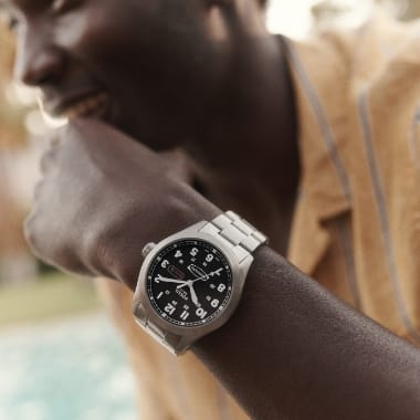 A man wearing a Neutra watch.