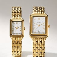 A pair of Raquel watches, one mini, one full size.