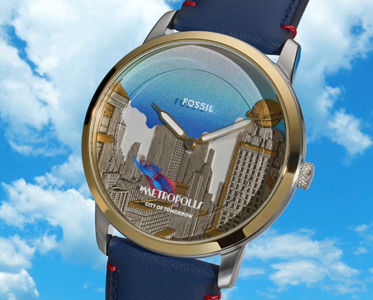 A heroic shot of the Shelby and Fossil Grand Tourer limited-edition chronograph, featuring a stainless steel case and blue-and-white striped dial inspired by iconic Shelby racing vehicles.