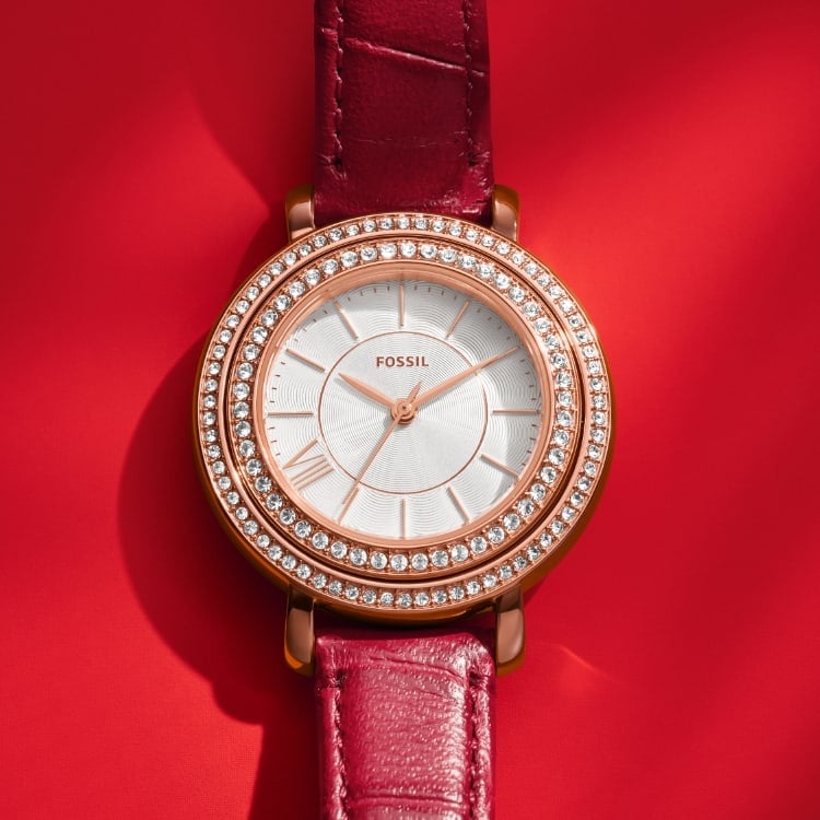 A GIF featuring our Jacqueline watch's hand-set crystals an dial and its enamel-filled caseback.